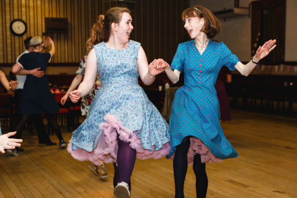 Two female's doing the charleston dance